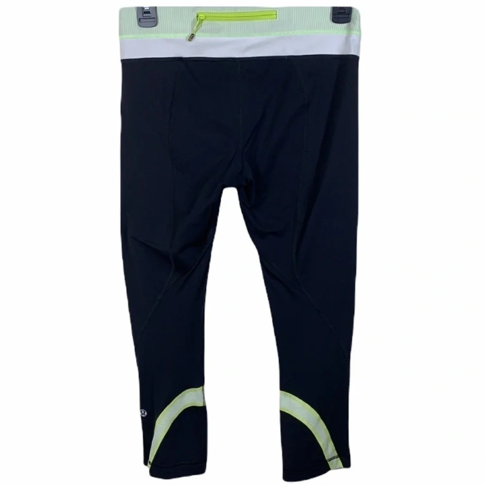 Lululemon black and yellow skull soul cycle crops